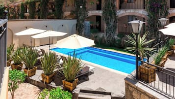 Outdoor pool, open 9:00 AM to 9:00 PM, pool umbrellas, sun loungers