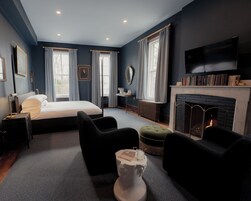 Suite, 1 King Bed, Courtyard View | Down comforters, individually decorated, individually furnished