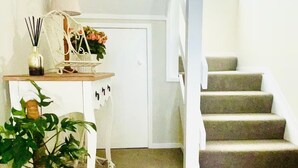 A staircase with carpeted steps leading to a landing. - 3 Bdroom two-level townhouse close to Devonport  (Auckland)