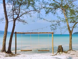 On the beach, white sand, sun loungers