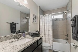 Hair dryer, towels, soap, shampoo