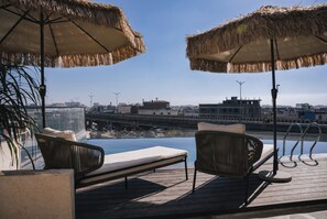 Outdoor pool, open 8:00 AM to 7:00 PM, sun loungers