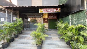 The entrance of New Hotel Prince Palace with a sign indicating the 2nd floor. - New Hotel Prince Palace (Mumbai)