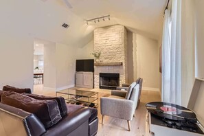 TV, fireplace, books, offices