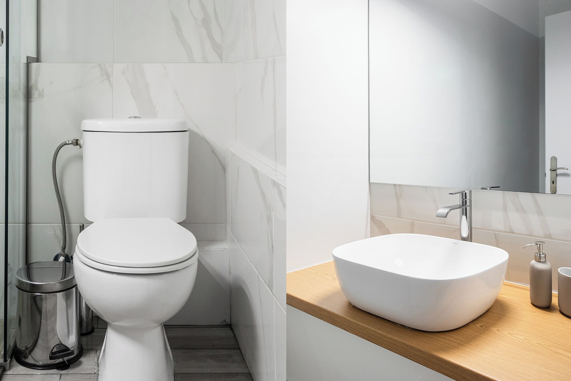 A modern bathroom with a white toilet, a bidet, and a sink with a wooden countertop.