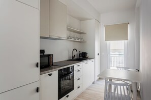 Family Apartment | Private kitchen | Full-sized fridge, microwave