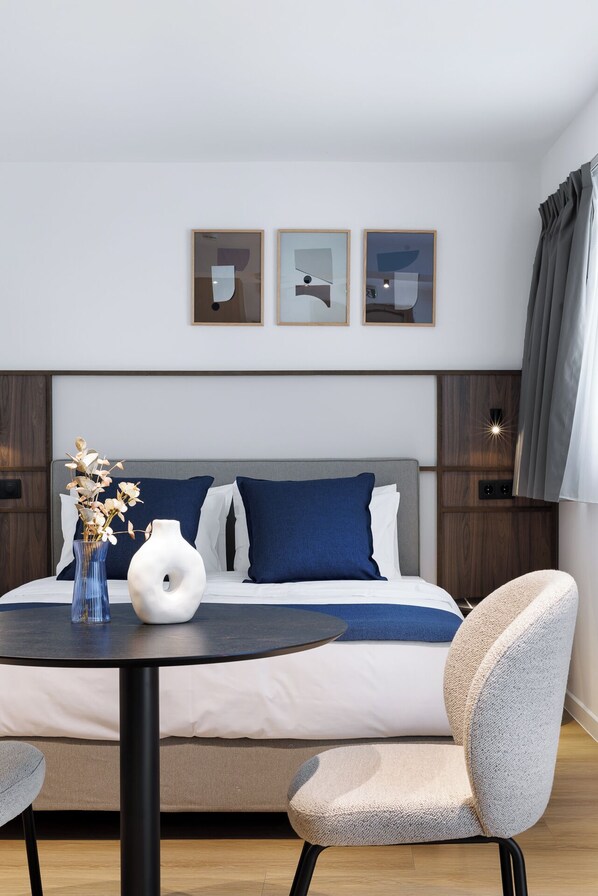 Less is MoRe | Desk, laptop workspace, blackout drapes, iron/ironing board