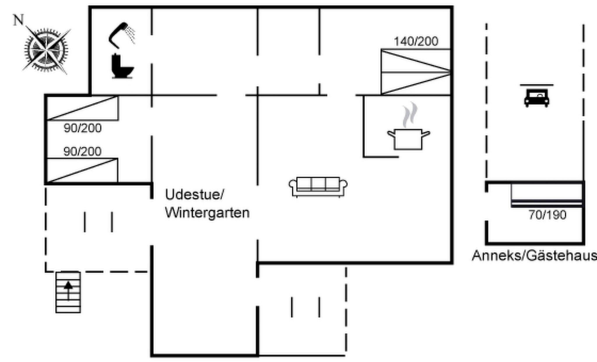 Plano de planta que muestra una cocina, una sala de estar y un baño.