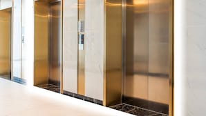 A modern elevator with a metallic finish and a control panel. - 1BR 12FL-Vinhomes Ocean Park Ha Noi (Hanoi)