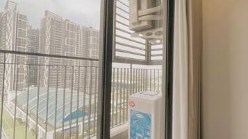 Luxury Apartment, Balcony, City View | 1 bedroom, desk, blackout curtains, iron/ironing board