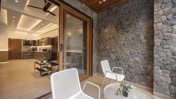 Premium Suite, Balcony, River View | Living area | 43-inch flat-screen TV with cable channels, books