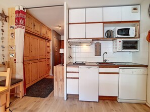 Enjoy cooking in this well-lit kitchen with microwave and dishwasher.