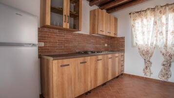 Superior Apartment, Sea View | Private kitchen | Fridge, stovetop, cookware/dishes/utensils