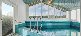Lovely holiday home with pool, spa and sauna, only 200 meters from the North Sea.