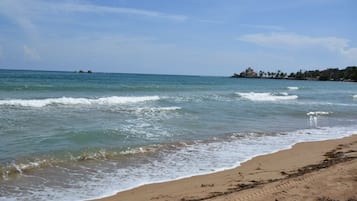 On the beach, sun loungers, beach towels
