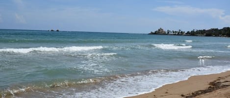 On the beach, sun-loungers, beach towels