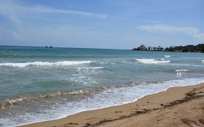 On the beach, sun loungers, beach towels