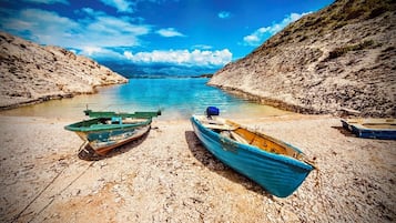 On the beach, sun-loungers
