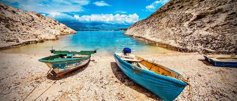 On the beach, sun-loungers