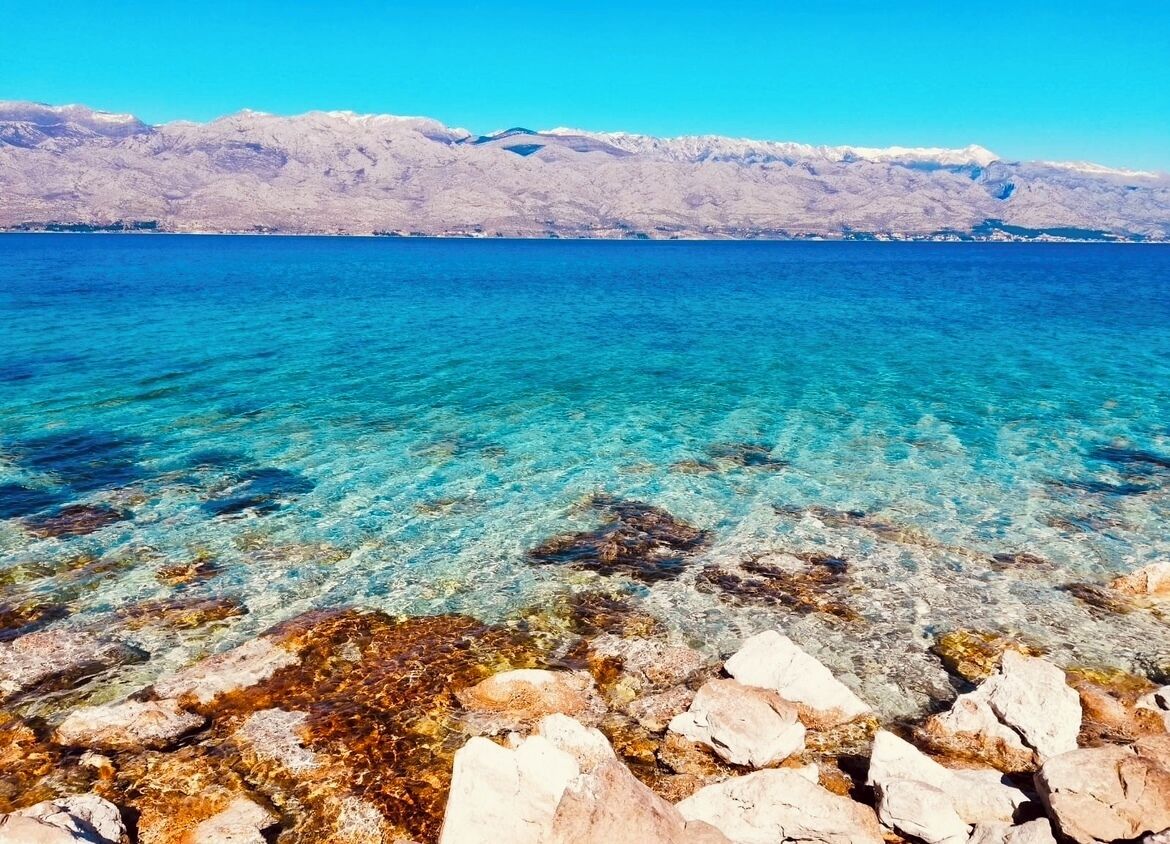 On the beach, sun-loungers