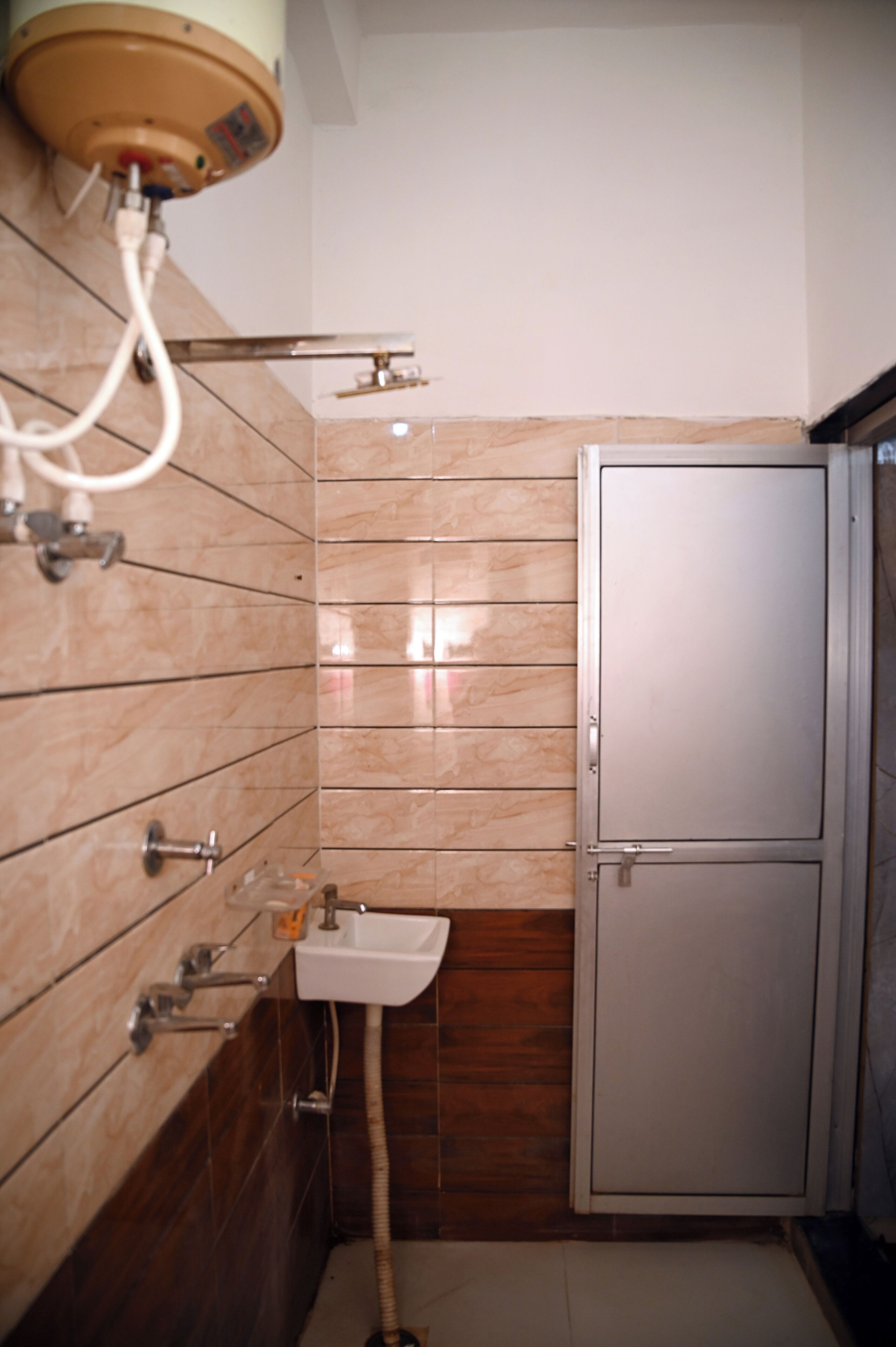A bathroom with a sink, a toilet, and a shower.