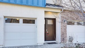 A house with a garage, a front door with a wreath, and a brick pathway leading to the entrance. - 4 Mi to Dtwn: Family-friendly Townhome in Reno (Reno)