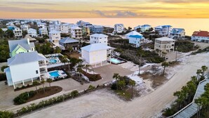 A coastal residential area with houses, a beach, and a pool. - Pool | Gulf Views | Outdoor Shower (Port St. Joe)