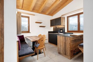 Fridge, stovetop, dishwasher, coffee/tea maker