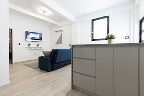 Comfort Apartment | Living area | 40-inch Smart TV with digital channels