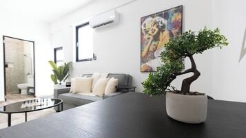 Deluxe Apartment | Living area | 40-inch Smart TV with digital channels