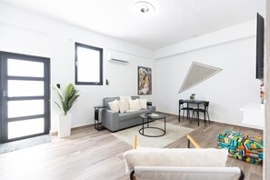 Deluxe Apartment | Living area | 40-inch Smart TV with digital channels