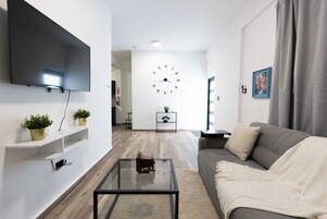 Deluxe Apartment, 2 Bedrooms, Kitchen | Living area | 40-inch Smart TV with digital channels