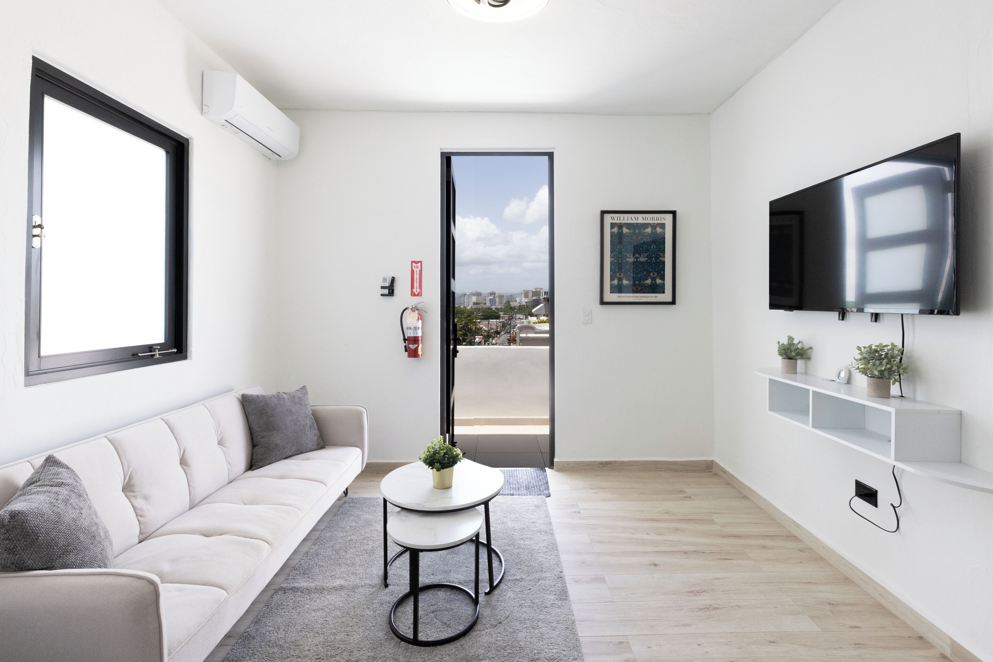 Comfort Apartment, City View | Living area | 40-inch Smart TV with digital channels