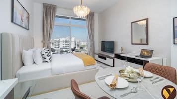 Luxury Studio, Pool View | Laptop workspace, iron/ironing board, cots/infant beds, free WiFi