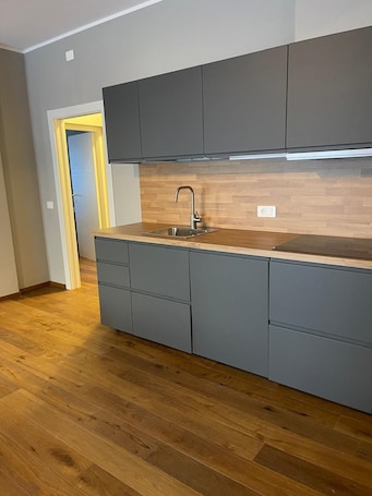 Family Suite | Living area | TV, heated floors