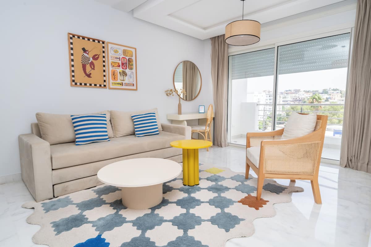 Deluxe Studio, Sea View | Living area | 50-inch Smart TV with satellite channels