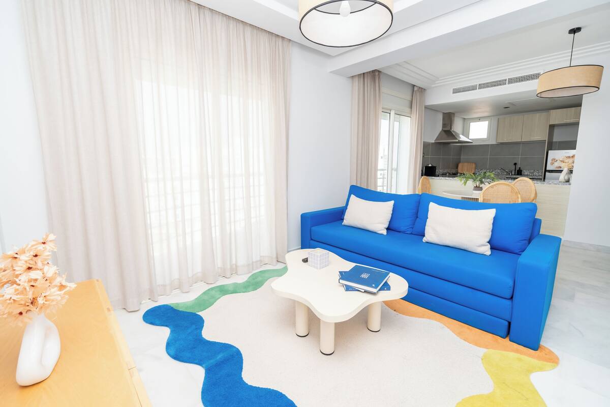 Comfort Studio | Living area | 50-inch Smart TV with satellite channels