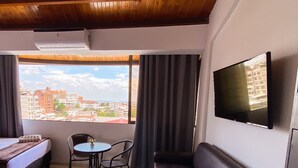 Deluxe Room, Private Bathroom, City View | Blackout drapes, bed sheets - Hostal CaliView Inn (Cali)