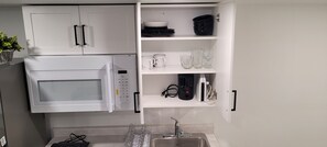 Fridge, microwave, stovetop, coffee/tea maker