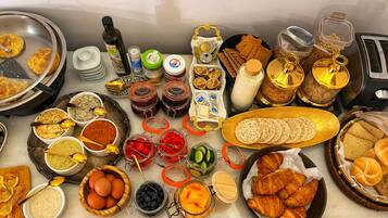 A breakfast buffet with various food items and condiments.