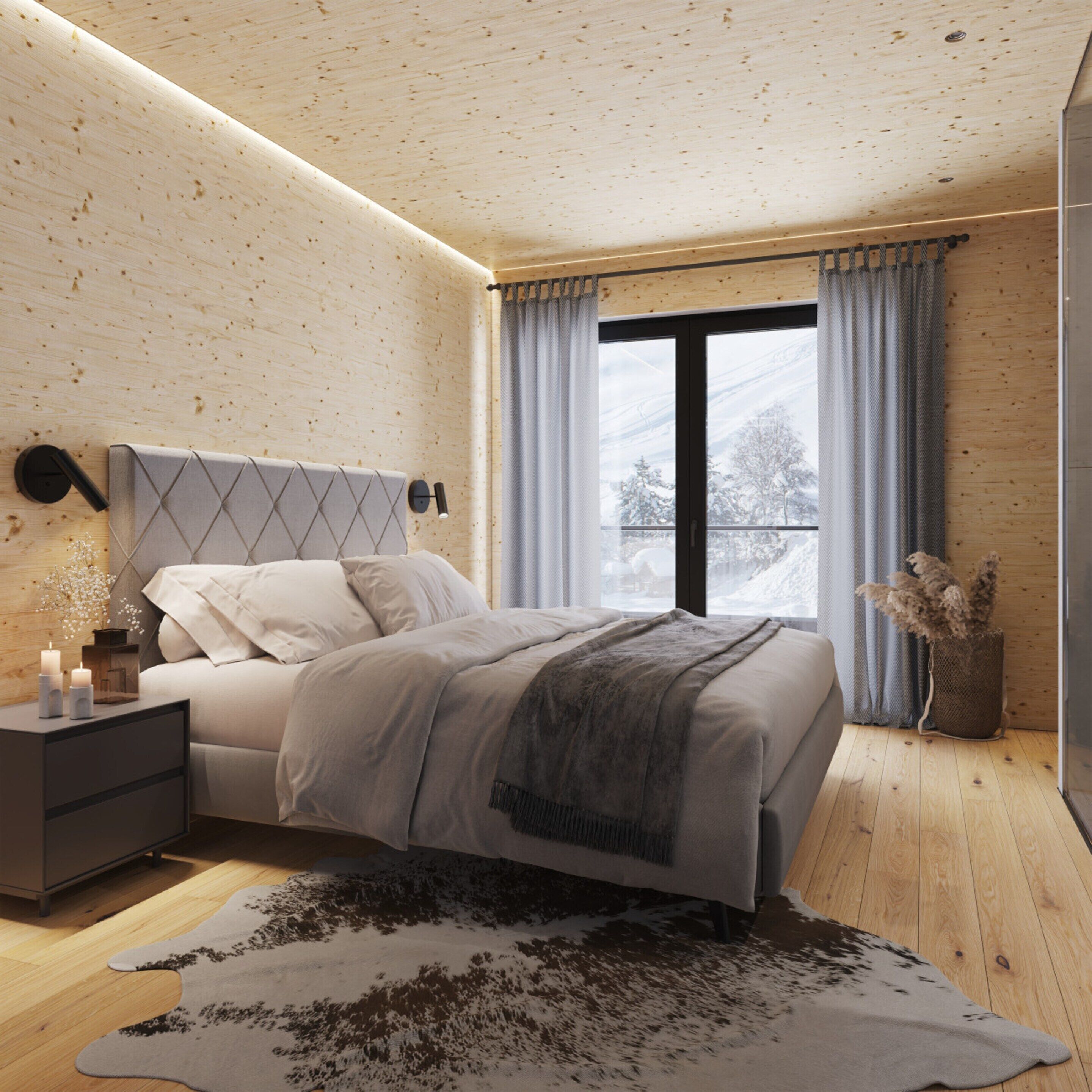 Une chambre moderne avec un plafond en bois, un lit doté d’une tête de lit grise, une table de chevet avec des bougies, et une vue sur un paysage enneigé par la fenêtre.