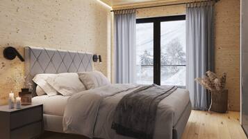 A modern bedroom with a wooden ceiling, a bed with a grey headboard, a bedside table with candles, and a view of a snowy landscape through a window.