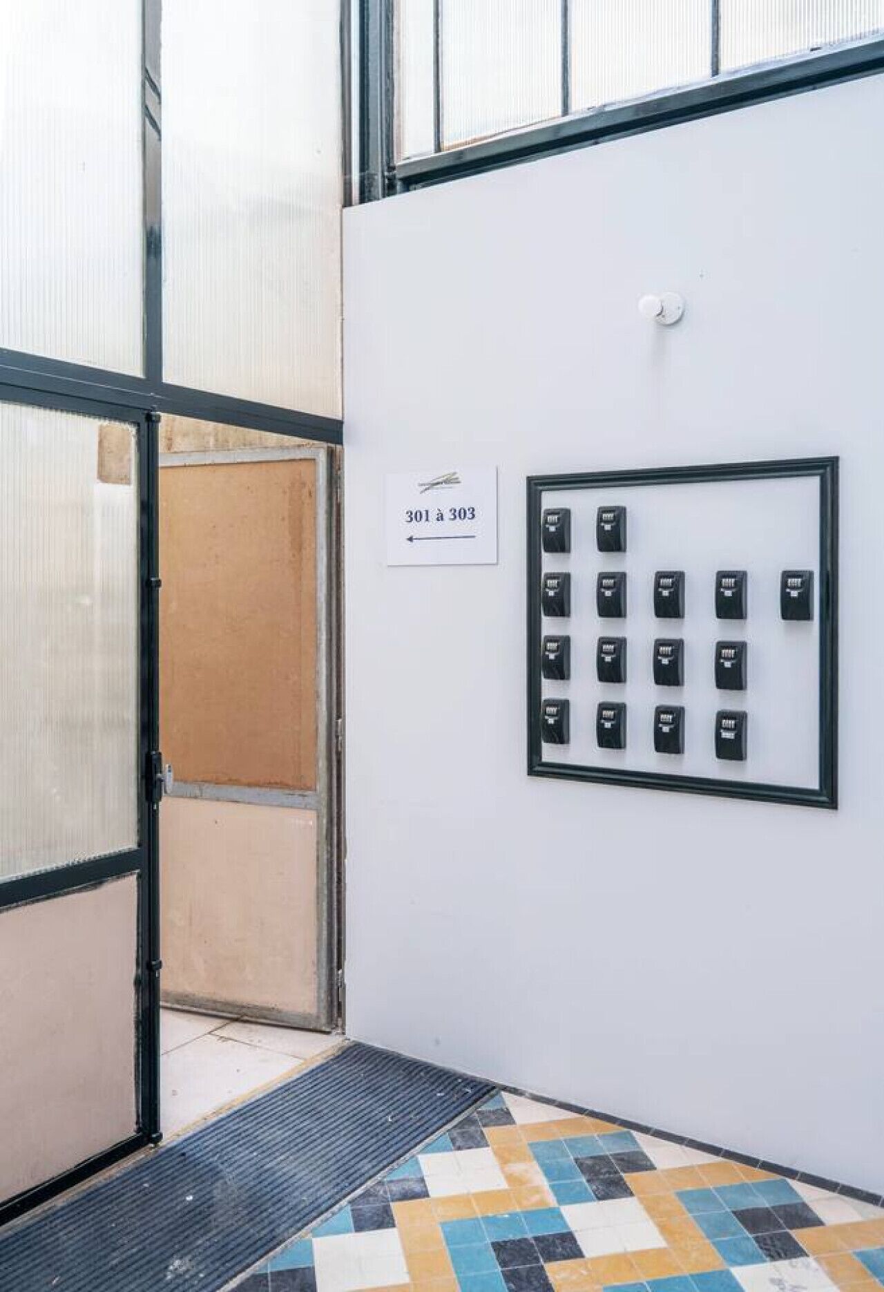 An elevator with a sign indicating floors 301 to 303.