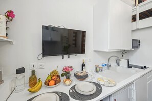 Fridge, microwave, stovetop, coffee/tea maker