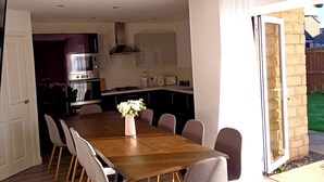 A modern kitchen with a dining area. - Elysian Escape, modern 5 bedroom house, sleeps 12 (Darlington)