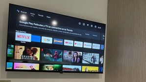 A flat-screen TV mounted on a wall displaying a streaming service interface with various content categories. - Luxury Liv Limonar (Cali)