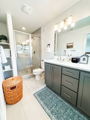 Shower, hair dryer, towels, soap