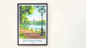 A framed picture of Victoria Park in London, a dining table set with plates, glasses, and cutlery, and two chairs.