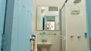 Shower, towels, soap, toilet paper