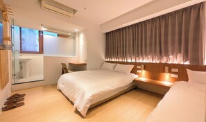 A modern bedroom with a large bed, a bedside table, a mirror, and a window with curtains. - Yen Inn (New Taipei City)